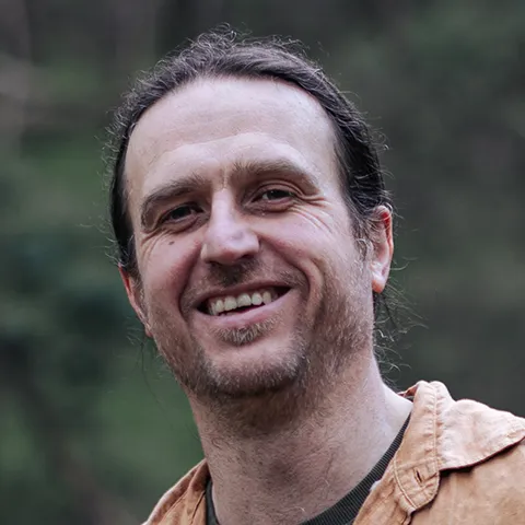 Richard Tronson, psychotherapist, outdoors in bushland